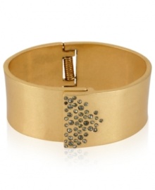 A touch of glass goes far in this bangle from Kenneth Cole New York. Crafted from gold-tone mixed metal, the bracelet is adorned with pave glass crystal accents for a fashion infusion. Approximate diameter: 2-3/8 inches.