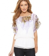 A soft floral print drapes down the front of this AGB top. Chiffon and the peplum hem add to the feminine feel!