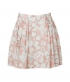 Stylish skirt in fine, printed cotton blend - Sweet, summery floral motif in pale pink and cream - Modified A-line silhouette bells at hem, hits mid-thigh - Gently pleated front, belt loops and button closure - Flattering and ultra-feminine, seamlessly transitions from work to weekend - Pair with a fitted t-shirt or button down blouse and sandals or ballet flats