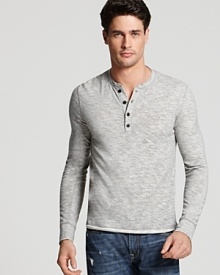 An elevated basic from Vince. This trim henley tee has a narrow button placket and allover heather texture.