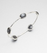 From the Rock Candy® Collection. Five faceted hematite doublet stations set on a hammered sterling silver bangle. Hematite doubletSterling silverDiameter, about 2.5Slip-on styleImported 