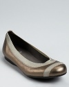 In shimmering metallic leather, these flexible ballet flats offer easily-stowable comfort and style.