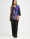 If you're looking for a flattering top to truly complement your shape, look no further than this stretch-satin design featuring an irresistible print. Pair it with your favorite straight-leg or slim-fit pants. One-shoulder styleDraped necklineOne sleeveGraphic print on frontAbout 30 from shoulder to hem97% polyester/3% elastaneDry cleanImported