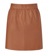 Stylish, lightly pleated skirt in supple, genuine leather - Chic, on-trend caramel color - Banded waist and back zip - Slim, flattering cut hits above the knee - Ideal for both day and evening - Go for a casual look with a white button down or cashmere pullover and ballet flats - Dress up with a silk top, blazer and platform booties