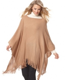 Light up the room. Metallic threading shines on this cozy knit ruana wrap by Cejon.