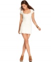 A hot summer must-have, this little white lace dress by Free People will go the mile when styled for both day and night -- pair it with embellished flats or sky-high heels!