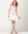 A sweet smattering of sparkling sequins and a sheer tulle overlay give this Adrianna Papell dress charming appeal.