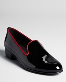 Slip into relaxed-yet-dressy patent leather smoking flats from Stuart Weitzman, perfect for playing hostess.