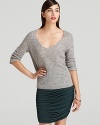 Touting soft tailoring and classic styling, this Halston Heritage sweater slips on for effortless elegance.