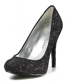 Rendered in sparkling lace, these exquisite pumps feature slight platforms. By IVANKA TRUMP.