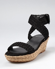 A low-key wedge for laid-back girls. With all the comfort of flats and the confidence of heels, Stuart Weitzman's Alexlo wedges offer chic and understated summer style.