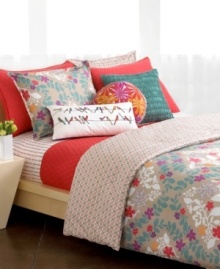 A fun poppy hue and eye-catching quilting make the Trellis duvet cover set an irresistible pick-me-up for tired decor. Top it all off with bright stenciled blooms, geometric prints and a pile of whimsical pillows in coordinating hues. (Clearance)