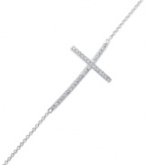 A stunning testament. This bracelet features a sideways cross with cubic zirconia accents adding a lustrous touch. Crafted from sterling silver. Approximate length: 7-1/2 inches. Approximate cross size: 1-3/8 inches x 3/4 inch.