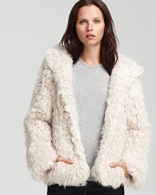 A lavish Theory fur jacket offers sumptuous cover as the weather turns cooler. Boasting a plush hood, the cozy silhouette infuses instant glamour into your days and nights for must-have 24-hour statement style.