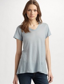 Incredibly soft and lightweight, this seasonless knit has short sleeves and an asymmetrical draped hem.Scoopneck Pullover style Short sleeves Flared, asymmetrical hem About 27 from shoulder to hem Cotton; machine wash Made in USA