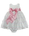 A charmingly traditional dress in multi-striped cotton seersucker has a pretty, full skirt with a petticoat and a ribbon sash.