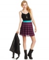 A spunky, plaid print makes this pleated skirt all about fun and audacious style! From Fire.