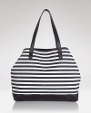 Statement stripes come about on Rebecca Minkoff's nautical canvas tote bag, boasting a roomy shape and leather trims. In buoyant style, this bag hints at yacht club chic.