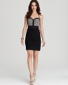 An ornately woven bodice lends an artisan feel to this summer-perfect GUESS dress, cut in a curve-defining silhouette.