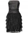 The ultimate party dress, this strapless design is tremendously glamorous in feminine lace-like black nylon - Sleek, slim corset top is sexy and flattering, while above-the-knee length tiered skirt brings movement - Needs only a clutch and peep-toe heels to complete the look