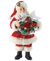 All the bells & whistles! With a decorative Christmas ball wreath in hand, this Santa figurine evokes the happiness associated with hanging holiday trim.