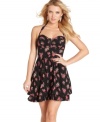 Eyelet design lends chic dimension to a pretty floral print dress, while a sweetheart neckline and halter straps add a hint of va-va-voom! From GUESS?.