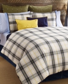 Bright and sunny. Finished with decorative buttons and the Tommy Hilfiger monogram, this Lake George decorative pillow features a yellow hue with navy blue trim in pure cotton canvas. Button closure.