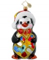 Wish for autism awareness with this charity ornament from Christopher Radko. A cute penguin clutches a colorful puzzle piece – the symbol of autism advocacy organization, Autism Speaks.