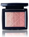 Shimmer like the star you are by dressing your skin with the light-filled jewel-like gleam of Dior's new allover Magic Shimmer pressed powder stars. Enriched with Jeweled Microdust, these 5 micro-shimmering tones set off sparks of brilliance. Ultra-fine super-blendable formula virtually fuses with skin for a sheer, radiant luminosity. Shimmer over forehead, temples, cheekbones and chin. In a chic, petite mirrored compact. 