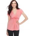 Ruffles and ruching at the empire waist add feminine flair to this Studio M top!