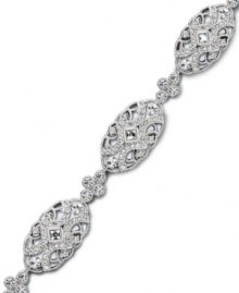 Sparkling style with a hint of vintage inspiration. Eliot Danori's stunning bracelet features swirls of round and square-cut crystal in a chic oval pattern. Set in silver tone mixed metal. Approximate length: 7-1/4 inches.