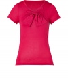 An upgrade to a basic tee in pink modal, this top is soft and feminine - Features a round neckline, large, decorative bow and short sleeves - Comfortable tee-like quality with the elegance of a blouse - Wear with a pencil skirt, opaque stocking and heels, or with a favorite pair of jeans and ballet flats