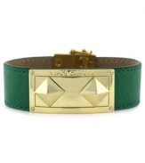 A green leather bracelet gets even bolder. This magnetic closure bracelet from Vince Camuto features an ID plate and pyramid studs crafted from gold-tone mixed metal to really make a name for itself. Approximate length: 8 inches.