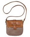 An earthy elegance adds appeal to this versatile bag by Fossil. An easy access flap design and vintage-inspired hardware create the perfect blend of fashion and function.