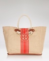 Tory Burch's straw tote is a perfect companion for your casual looks. When weekend adventures beckon, this beachy bag is at its best when filled to the brim.