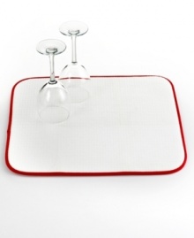 Where dishes go to dry. Cushioned and super absorbent, this kitchen mat sets up a place where your delicate dishes and stemware, plus everyday essentials, can hang out to dry after a wash. The folding, machine-washable design is perfect for easy storage and quick cleanup, too.