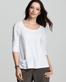 This Eileen Fisher top is rendered in luxe linen with ribbed knit trim and a pocket at the hem for easy access to small belongings.