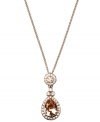 Add a regal touch to any look in Givenchy's silk teardrop pendant. Crafted from brown gold-plated mixed metal, necklace incorporates shimmering topaz and clear-colored crystals. Approximate length: 16 inches + 2-inch extender. Approximate drop: 1-1/2 inches.