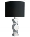 A better black light. Turn on the drama with the sculpted metal base and black drum shade of Nambe's Kurv lamp. A unique piece for modern console or end tables.