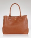 This classic tote rendered in luxurious Saffiano leather is sure to be an all-time favorite. From Tory Burch.