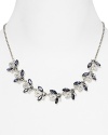 Delicate clusters of colored stones are a glamorous focal point on this Carolee necklace, crafted of silver plated metal.