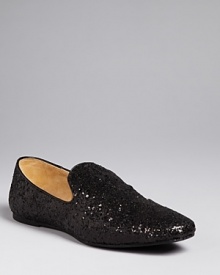 In shimmering black glitter, Ted Baker's smoking flats lend chic sparkle.