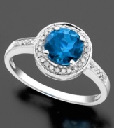 Stately in its simplicity, this 14k white gold ring features round-cut blue topaz (1-5/8 ct. t.w.) and round-cut diamond (1/8 ct. t.w.).