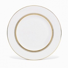 Rings of gold adorn fine white bone china with the lustrous shine of a wedding band. White bone china features two different border trims of gold, a wide corded border of textured grosgrain ribbon on some pieces, a narrow edge on others.