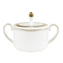 Rings of gold adorn fine white bone china with the lustrous shine of a wedding band. White bone china features two different border trims of gold, a wide corded border of textured grosgrain ribbon on some pieces, a narrow edge on others.