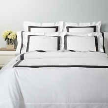 A classic navy sateen border trims this elegant sham by SFERRA, woven from super soft Egyptian cotton.