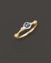 A faceted blue topaz and brilliant diamonds add bright color to gleaming 18K yellow gold. By Carelle.