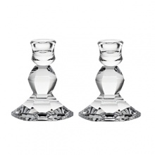 With a classic scalloped shape, these luminous Vera Wang candlesticks lend timeless grandeur to your table.