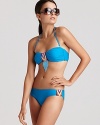 In lush turquoise with a riveting print, Mara Hoffman's bandeau bikini set is pool-hued and head-turning.