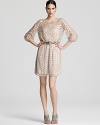 A zigzag pattern of sequins sparkles on this Aidan Mattox dress, finished with blouson sleeves and a narrow belt.